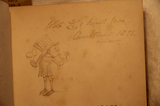 Lewis Carroll's inscription and drawing of The Mad Hatter