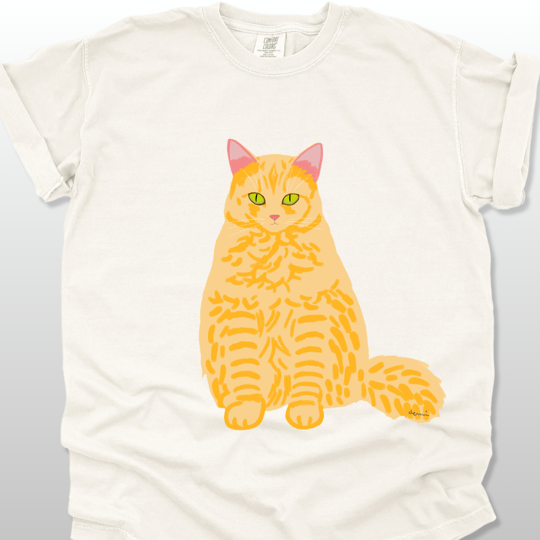 An ivory unisex T-shirt with a cat graphic on the front.