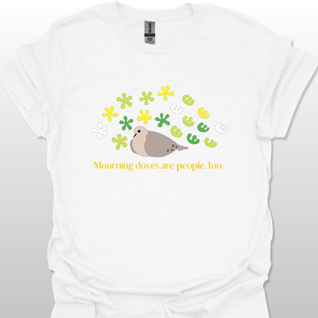 White t-shirt with a graphic of a dove and flowers, text 'Mourning doves are people too.' on a white background