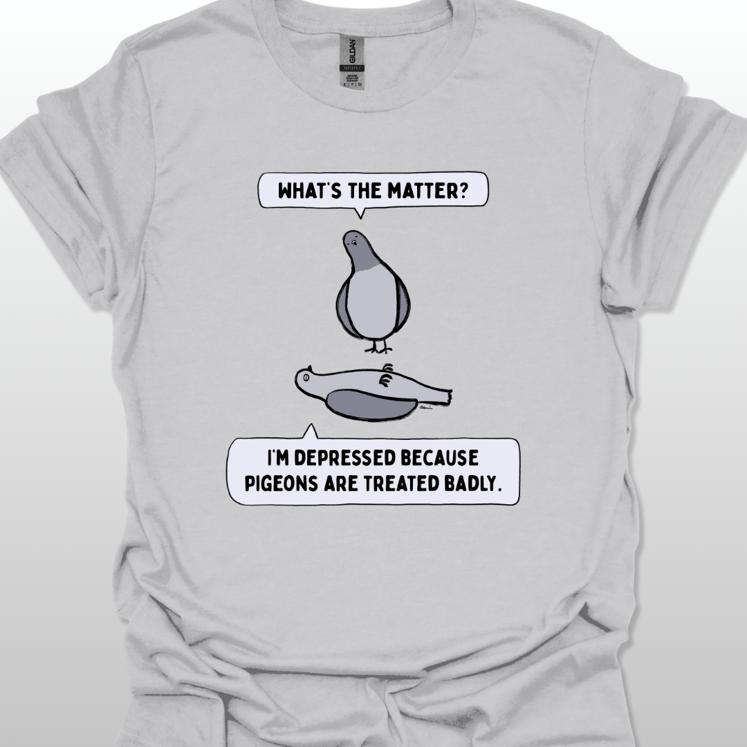 Grey t-shirt with a graphic of two pigeons saying, "What's the matter?" "I'm depressed because pigeons are treated badly." on a white background