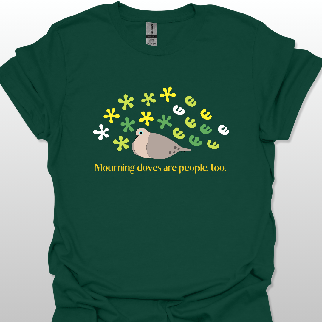 Forest green t-shirt with a graphic of a dove and flowers, text 'Mourning doves are people, too.'