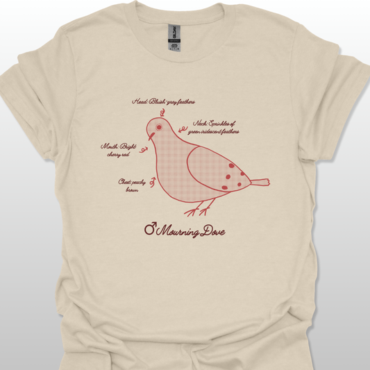 Sand t-shirt with a red dove illustration and text on a light gray background
