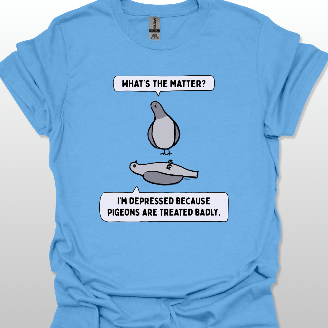 Blue t-shirt with a graphic of two pigeons saying, "What's the matter?" "I'm depressed because pigeons are treated badly." on a white background