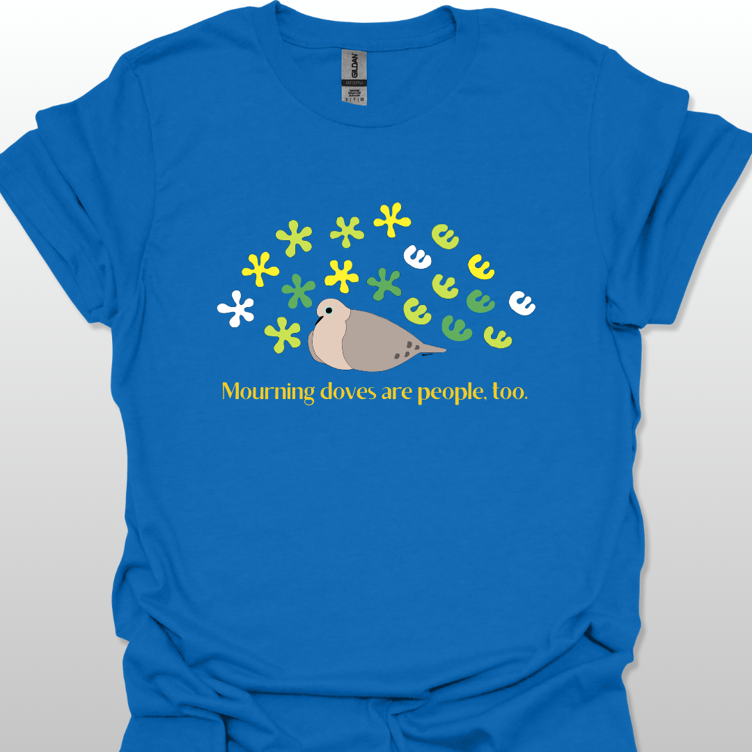 Blue t-shirt with a graphic of a dove and flowers, text 'Mourning doves are people too.' on a white background