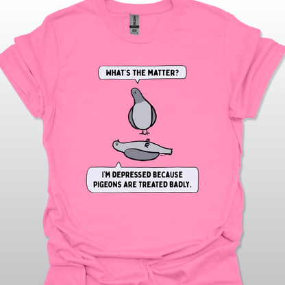 Azalea t-shirt with a graphic of two pigeons saying, "What's the matter?" "I'm depressed because pigeons are treated badly." on a white background