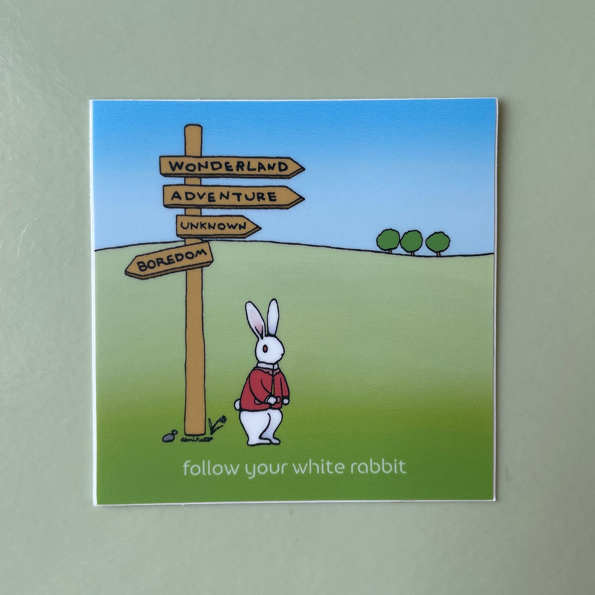 The White Rabbit is standing on a hill next to guide posts pointing to Wonderland, adventure, unknown, and boredom. The letter says, follow your white rabbit