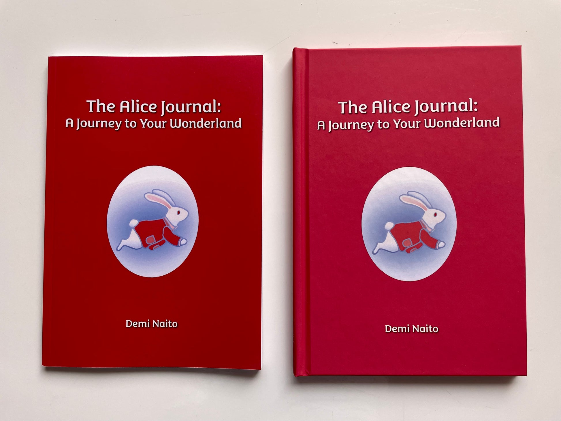 The softcover and hardcover books of The Alice Journal