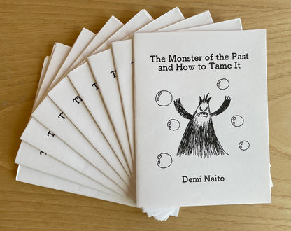 Stack of zines titled 'The Monster of the Past and How to Tame It' by Demi Naito.